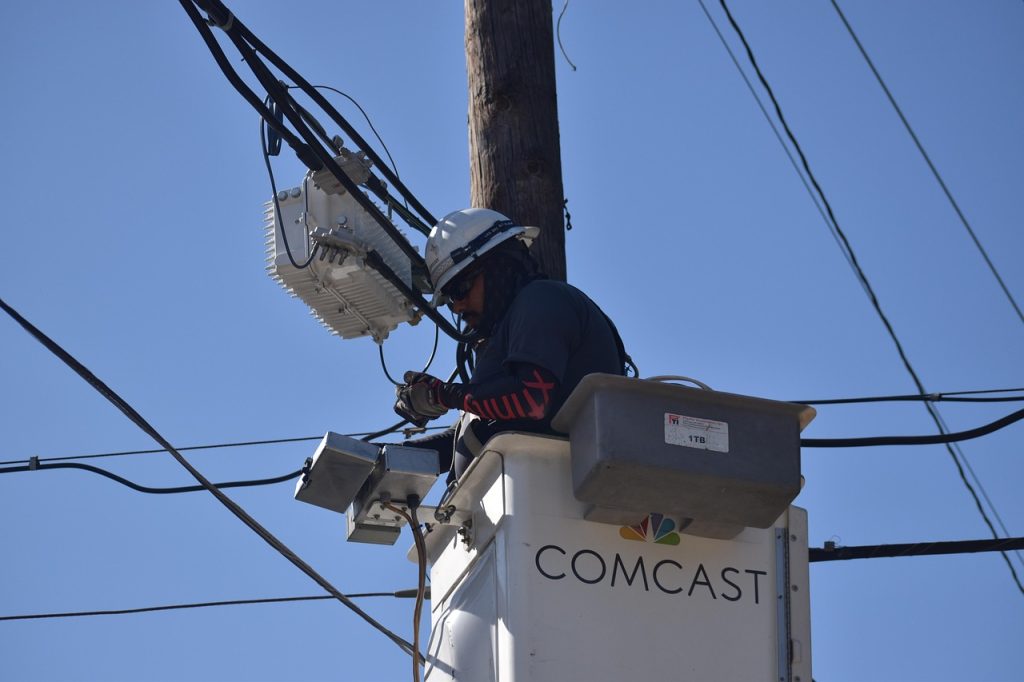 cable repairman, technician, comcast, xfinity, repairman, maintenance, electrician, electrical wires, wiring repair, professional, utility pole, service, electrical cables, electricity, hard work, worker, hardhat, job, houston texas, dangerous work environment, employment, 2024-2025